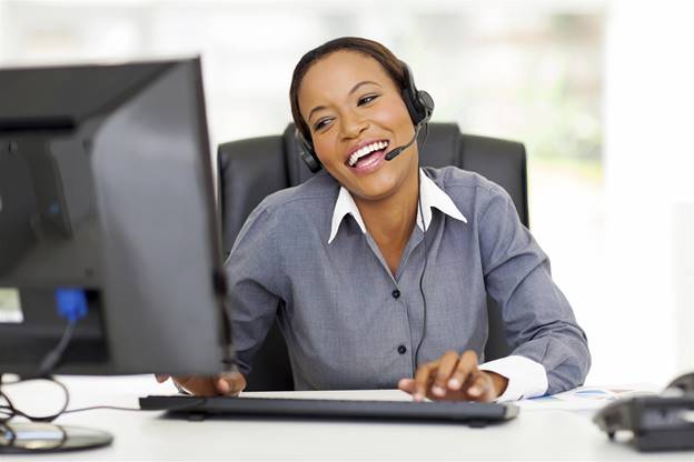 business woman on phone entering data