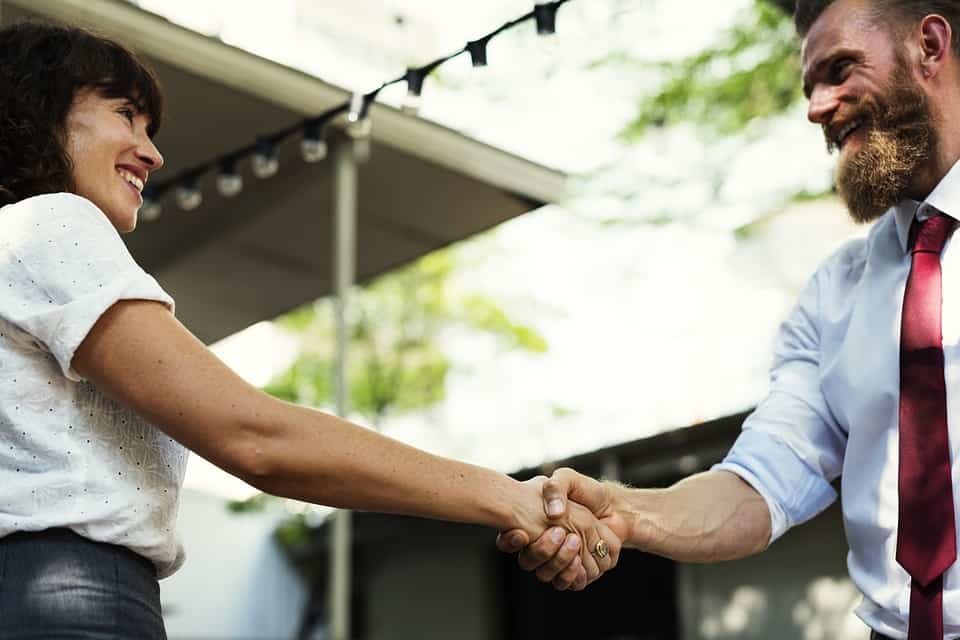 business colleagues shaking hands after meeting