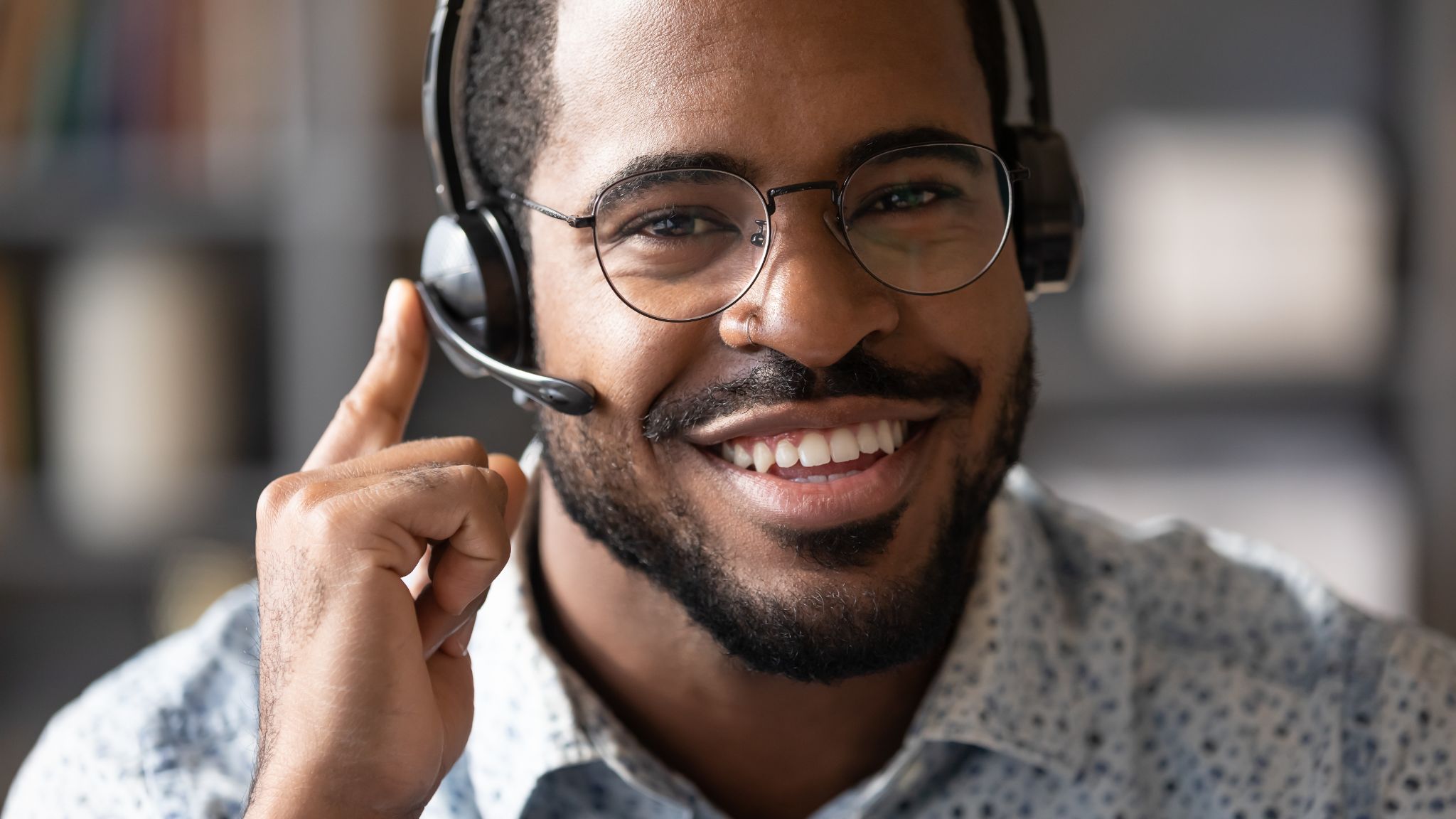 african man wear headset with microphone smile look at camera