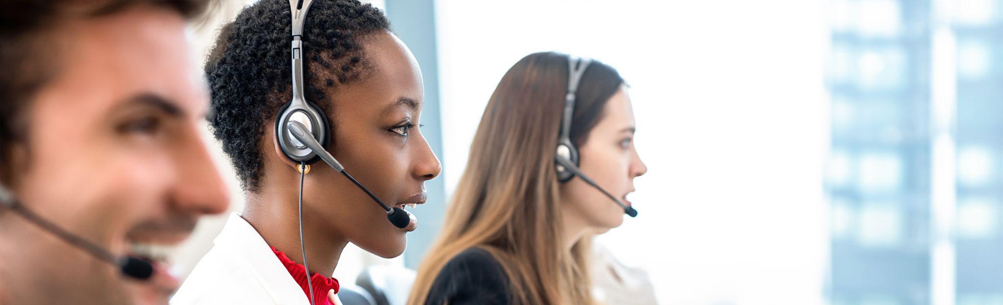call centre employees are smiling and working