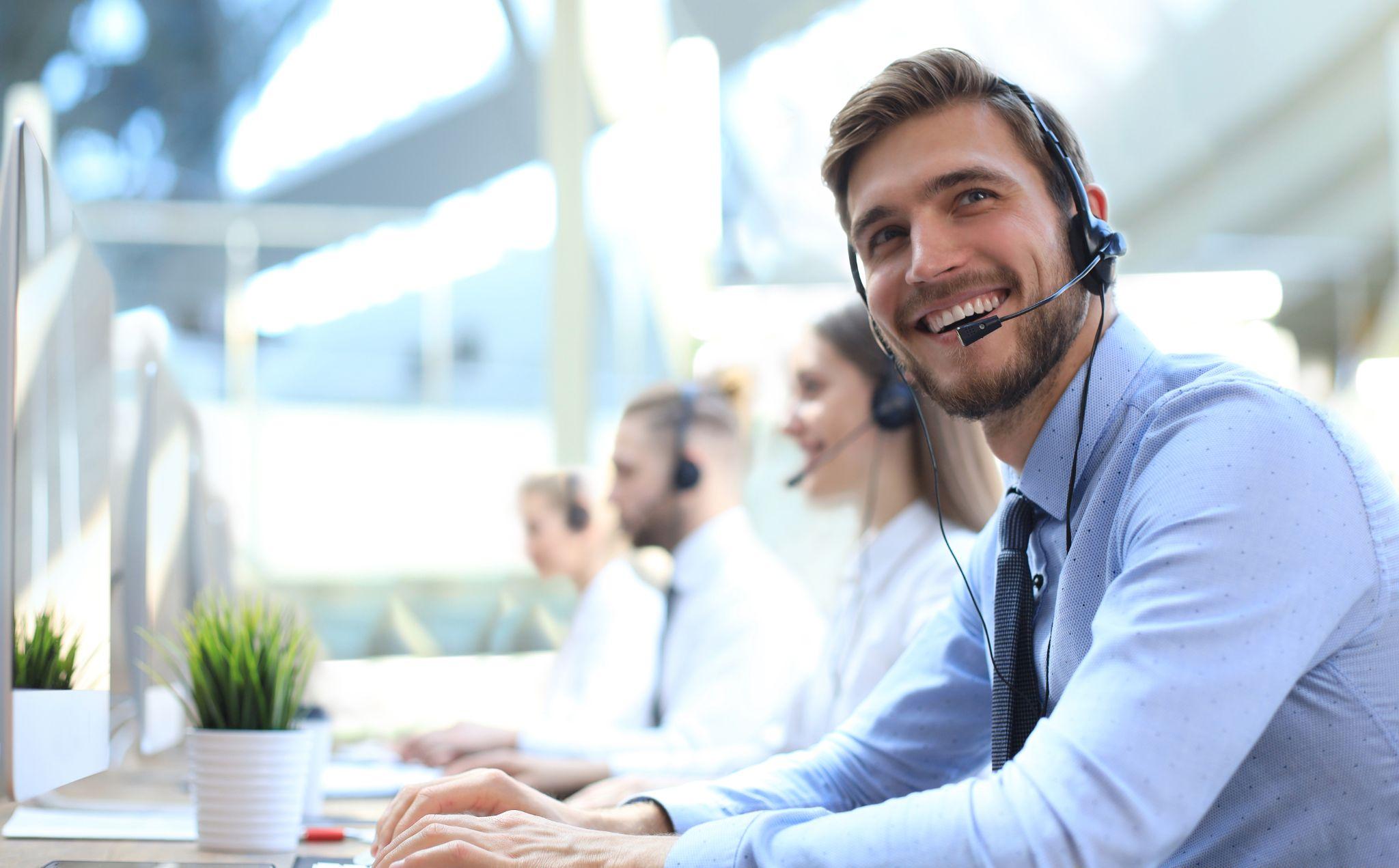 Smiling customer support operator at work