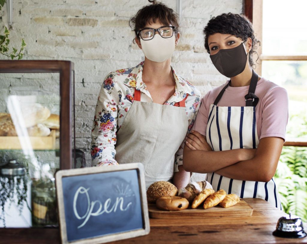 Bakery shop open post covid pandemic new normal staff in face masks