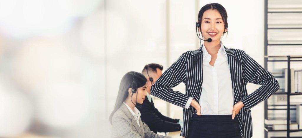 Business people wearing headset working in office to support remote customer or colleague.
