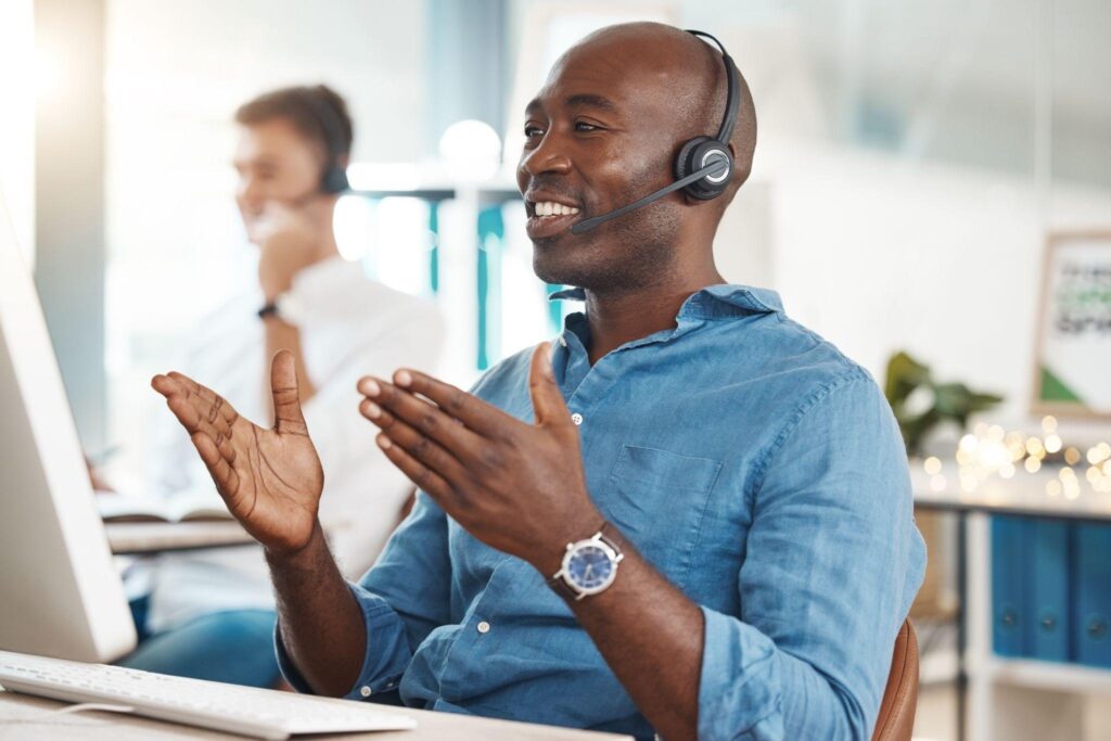 Customer service with a business man working in an office and consulting on a headset.